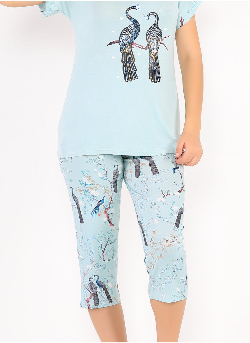 Dadoush - A set of Bermuda pajamas and a T-shirt with a flower and bird print reflects the joy and beauty of summer on your look. - Image 1