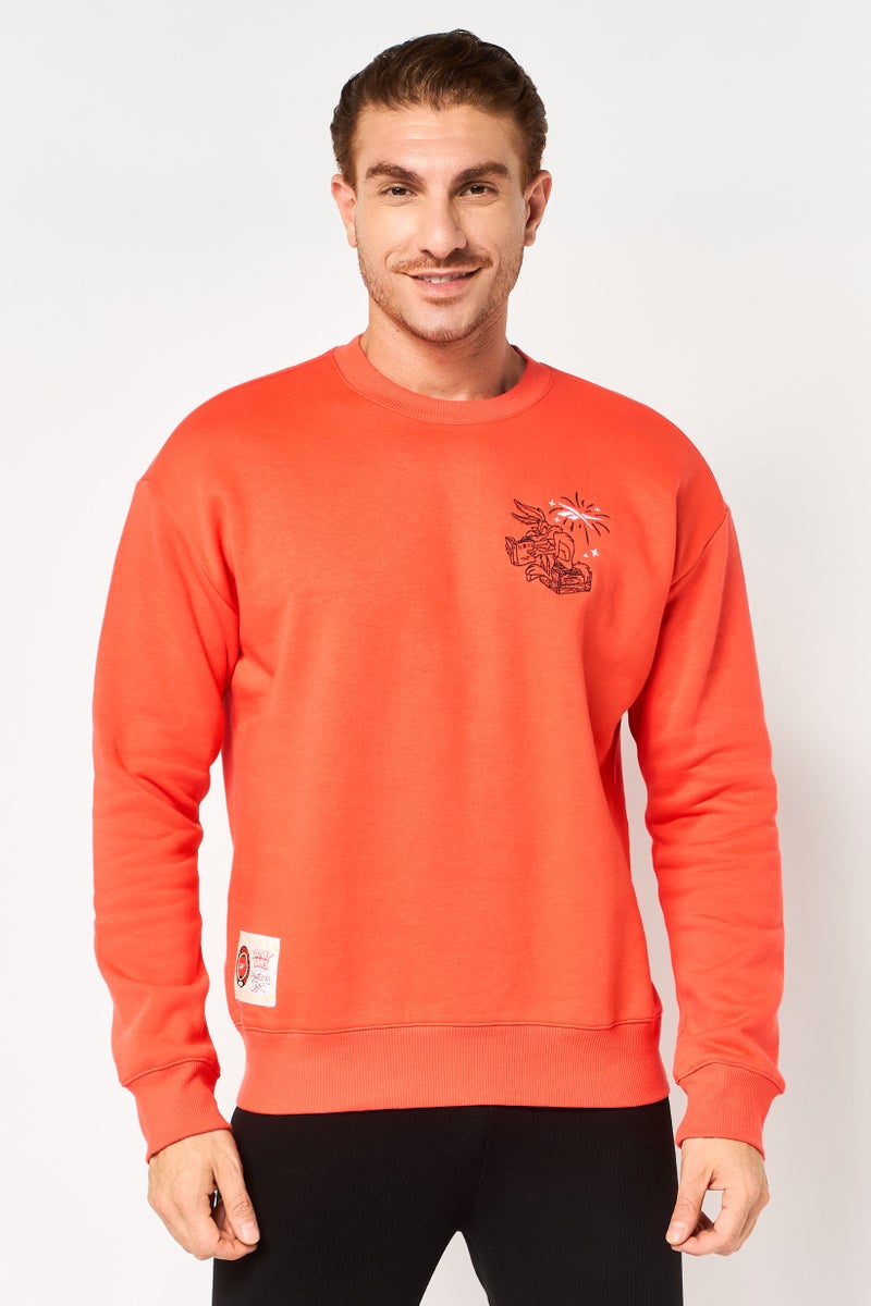 Reebok x Looney Tunes Men Sportswear Fit Long Sleeve Outdoor Sweatshirt, Coral - Image 1