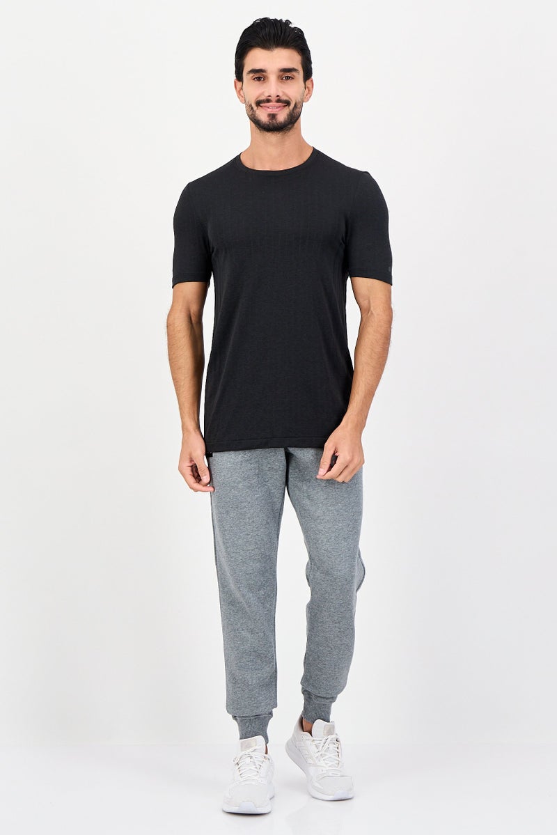 UNDER ARMOUR تي شيرت تدريب قصير الأكمام للرجال، أسود - Image 4