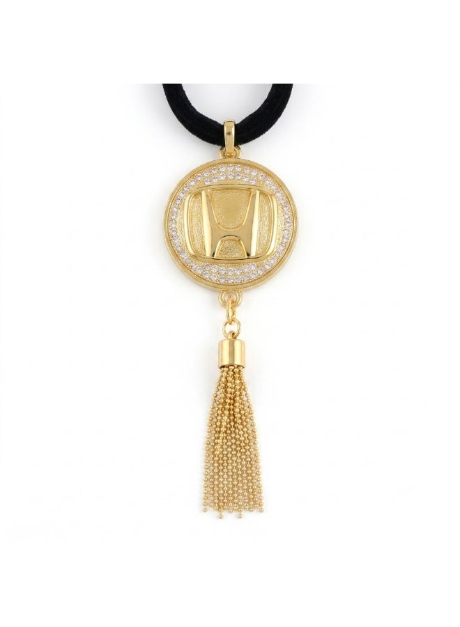 A stylish car pendant featuring a gold metal Honda logo and a touch of luxury crystal.