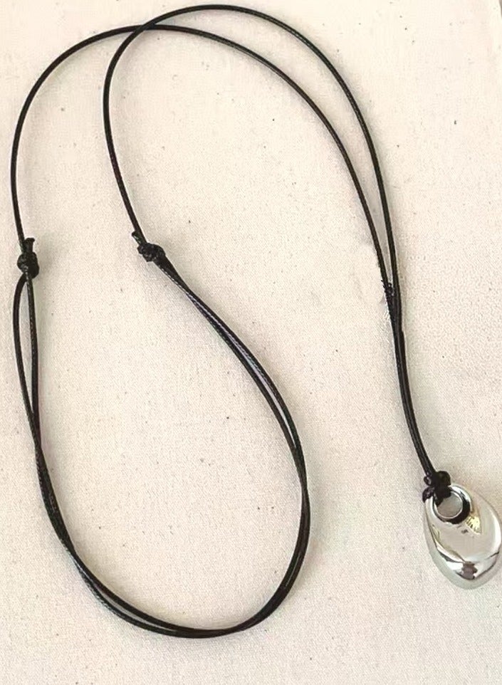 Elegant Silver Oval Pendant on a Black Cord Necklace | Stylish and Practical Gift Choice - Image 2