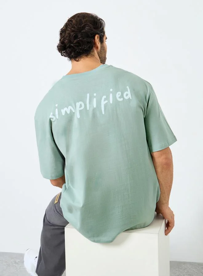 Styli Styli Men Oversized Minimal Typographic Back Graphic T-Shirt