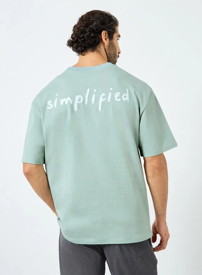 Styli Styli Men Oversized Minimal Typographic Back Graphic T-Shirt
