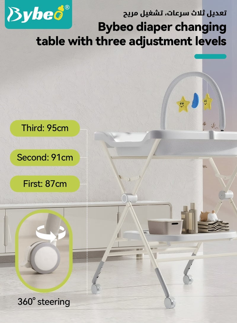 بيبو طاولة تغيير حفاضات الأطفال 2 في 1 وحوض استحمام للأطفال، محطة حفاضات الأطفال بارتفاع قابل للتعديل مع وسادة حفاضات سميكة، رف ألعاب وعجلات، منظم حضانة محمول لمستلزمات حديثي الولادة - Image 5