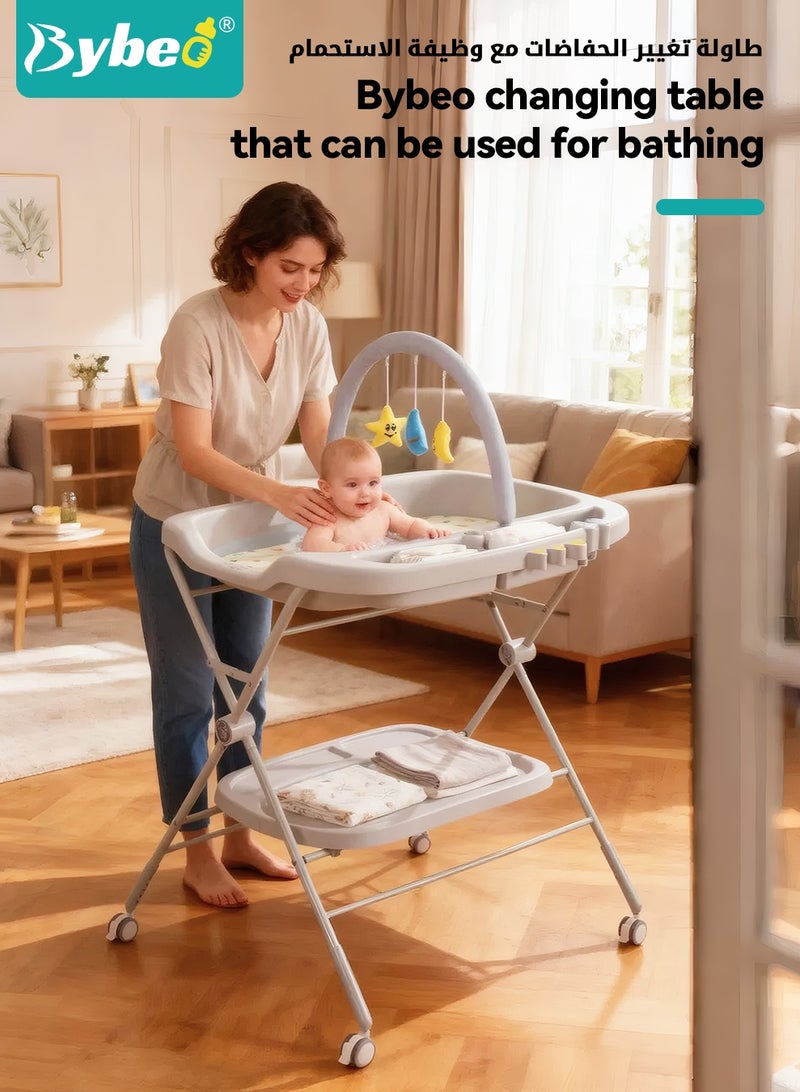 بيبو طاولة تغيير حفاضات الأطفال 2 في 1 وحوض استحمام للأطفال، محطة حفاضات الأطفال بارتفاع قابل للتعديل مع وسادة حفاضات سميكة، رف ألعاب وعجلات، منظم حضانة محمول لمستلزمات حديثي الولادة - Image 4