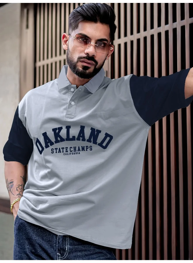 مانياك تيشيرت قطن مقاس كبير رجالي بياقة بولو مطبوعة وأكمام 3/4 باللون الرمادي الفاتح والكحلي