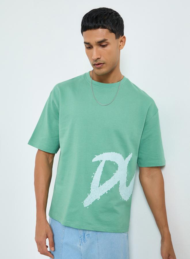 Styli Men Green Graphic Print Oversized T-Shirt - Image 1