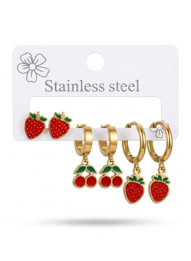 Stainless Steel Fruit Earring Set for Standard Pierced Ears, 3-in-1 3-Pair Earring Set with 6 Individual Earrings, Gold-Tone Fruit Jewelry with Glossy Red Fruit Enamel and Green Stem and Leaf Enamel Details for Women, Teens and Girls, Includes Strawberry Charm Dangle Huggie Hoop Earrings and Strawberry Drop Earrings, Small Cherry Motif Huggie Hoop Earrings and Cherry Hoop Earrings in a Pierced Ear-Cuff Style - Image 1