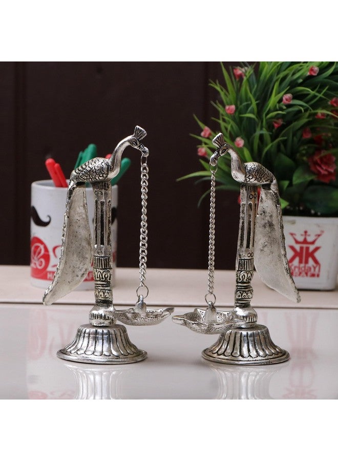 KridayKraft Peacock Design Metal Hanging with Chain Diya Pair of Peacock Design Bird Diya Deepak Oil Lamp Metal Silver Finish Hanging Diya Pair Puja Gift Item Antique, Standard,Pack of 2 - Image 1