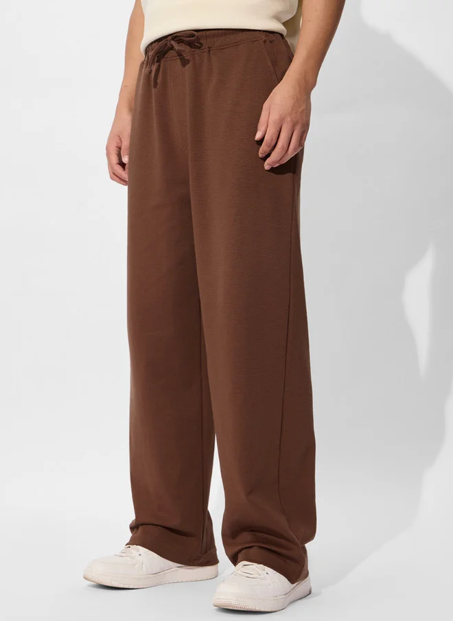The Souled Store  The Souled Store Men Brown Solid Cotton Straight Fit Joggers  | Best Price UAE