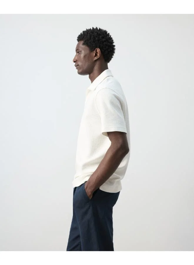 Mango Man  Regular-fit textured polo shirt for Men | Best Price UAE