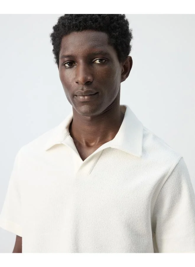 Mango Man  Regular-fit textured polo shirt for Men | Best Price UAE