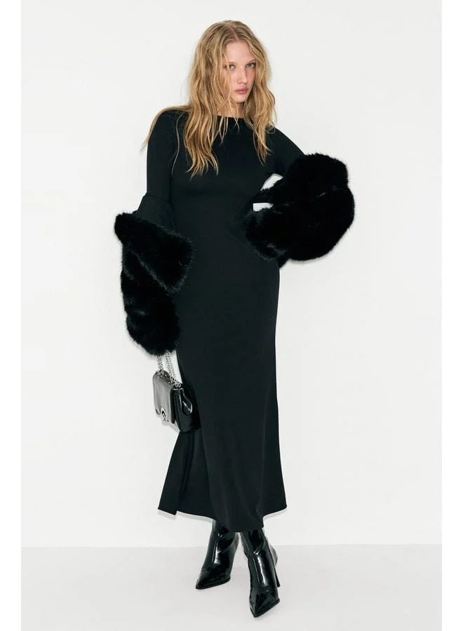GRIMELANGE NOCHE Women's round neck dress with a transparent back mesh and flexible fabric in black.