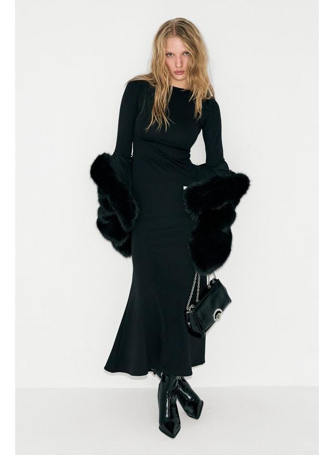 GRIMELANGE NOCHE Women's round neck dress with a transparent back mesh and flexible fabric in black. - Image 1