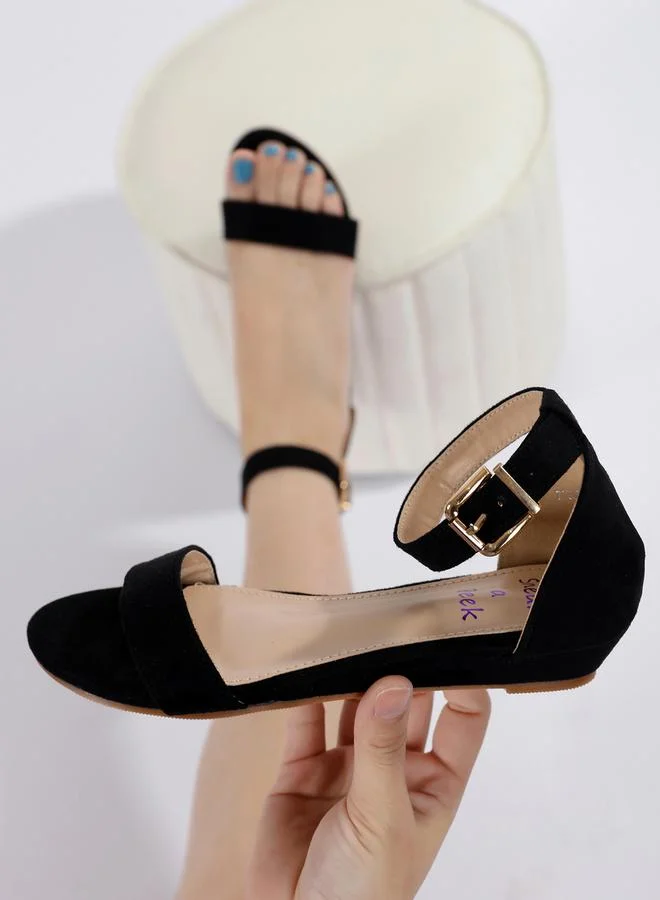 Sneak-a-Peek Solid Buckle Ankle Strap Open Toe Sandals by Styli