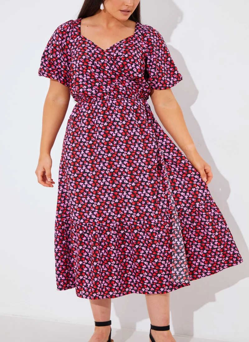 In the style Puff Sleeve Printed Wrap Dress