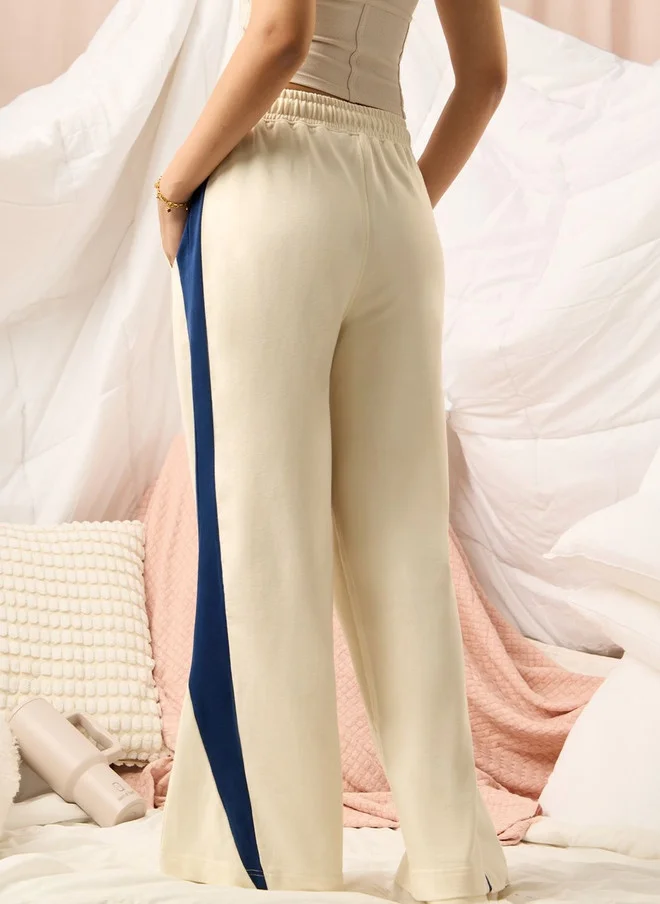 The Souled Store  The Souled Store Women Flared Fit Colourblocked Cream Joggers  | Best Price UAE