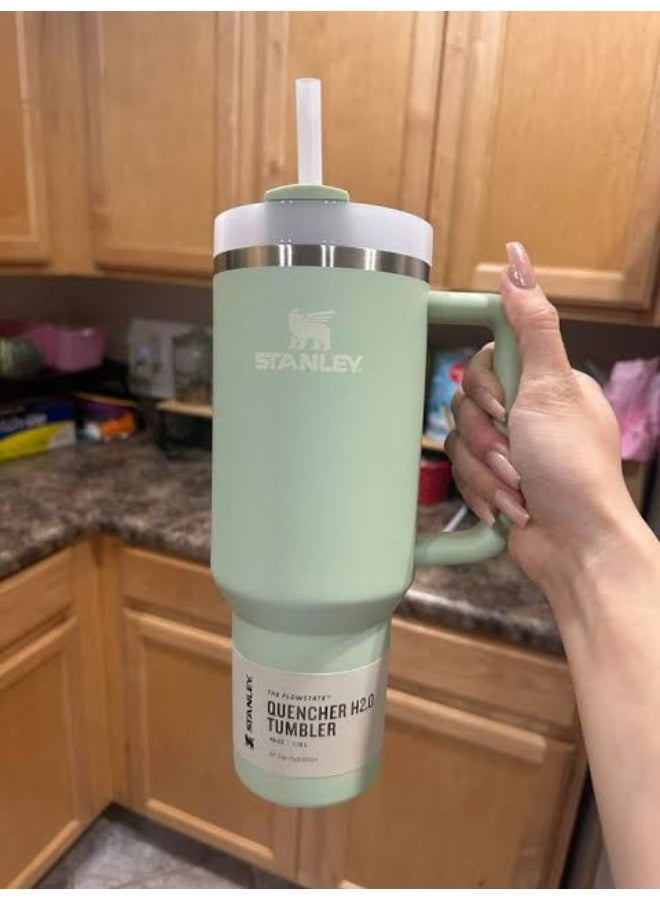 Stanley Quencher H2.0 Tumbler with Handle and Straw 30 oz | Flowstate 3-Position Lid | Cup Holder Compatible for Travel | Insulated Stainless Steel Cup | BPA-Free - Light Green - Image 1