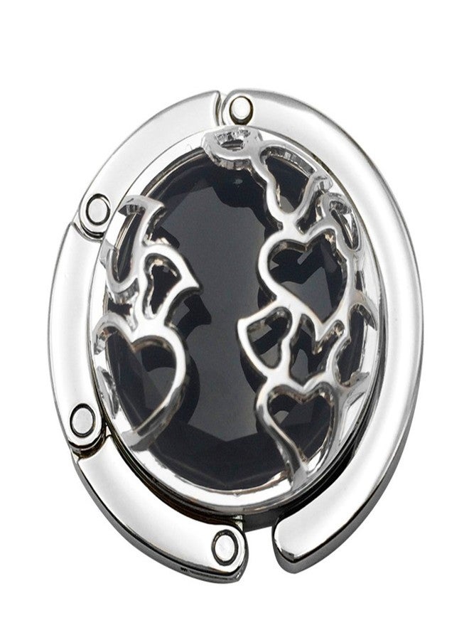 جيولبيوتي خطافات حقائب يد من Jewelbeauty، حامل للطاولة والمكتب، خفيف الوزن، مزين بحجر كريستالي على شكل قلب، قابل للطي، حقيبة كتف، حقيبة يد، علاقة فورية لتخزين الحقائب للنساء والفتيات (أسود) - Image 1