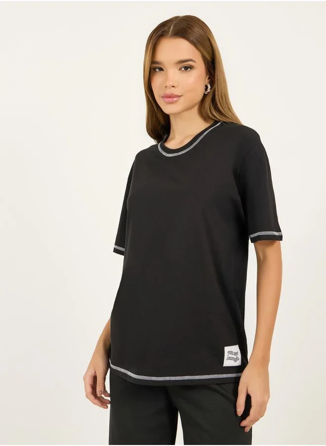 Styli Contrast Stitch Oversized T-Shirt with Badge Slogan Print Detail