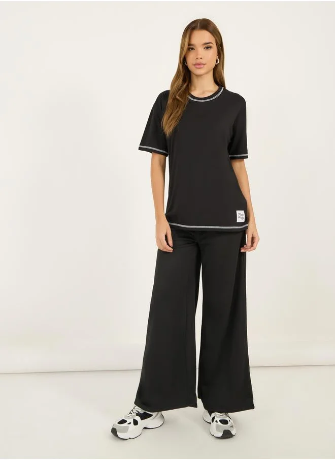Styli Contrast Stitch Oversized T-Shirt with Badge Slogan Print Detail