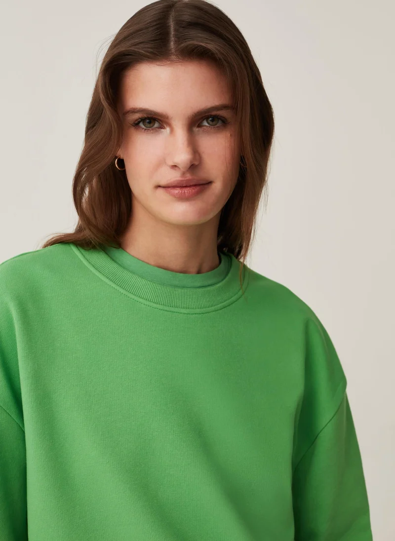 او في اس Solid colour round neck sweatshirt