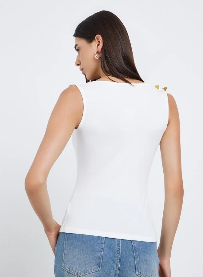 Styli Styli White Sleeveless Top with Butterfly Metal Accent