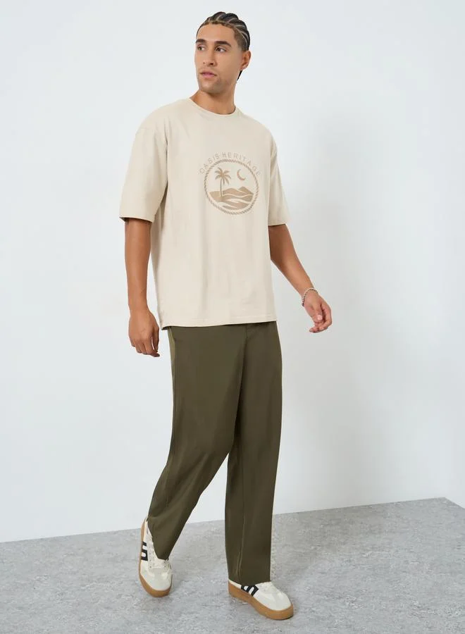 Styli Men Beige Graphic Print Oversized T-Shirt