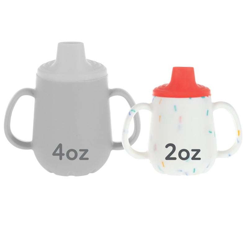 Nuby First Training Cup - Silicone Cup with Free-Flow Spout and Easy-Grip Design - 2 oz - 6+ Months - Coral and Sprinkles - Image 1