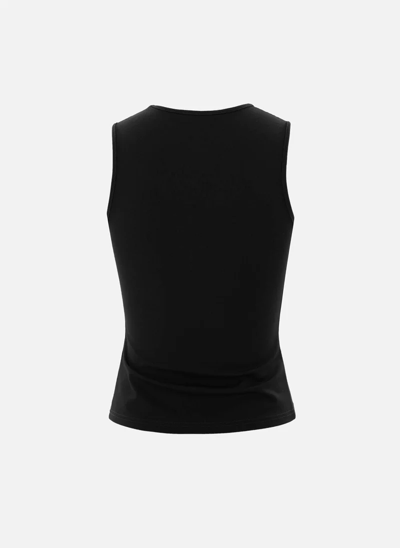 Lichi Top with asymmetrical straps and metal decorations