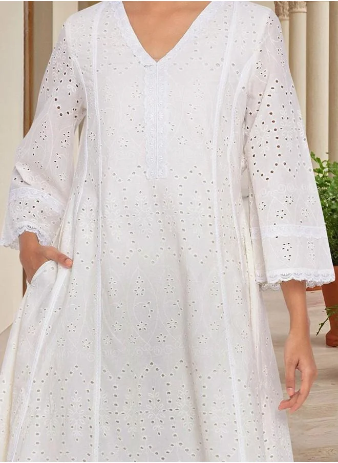 ISHIN Cotton Women Off White Cotton Kurta Set with Embroidered pattern Tunic and Palazzo features a Round neckline and Three-Fourth Sleeve secured with Elastic closure and styled in Straight Fit ideal for Festive moments — perfect for fashion-forward occasions.
