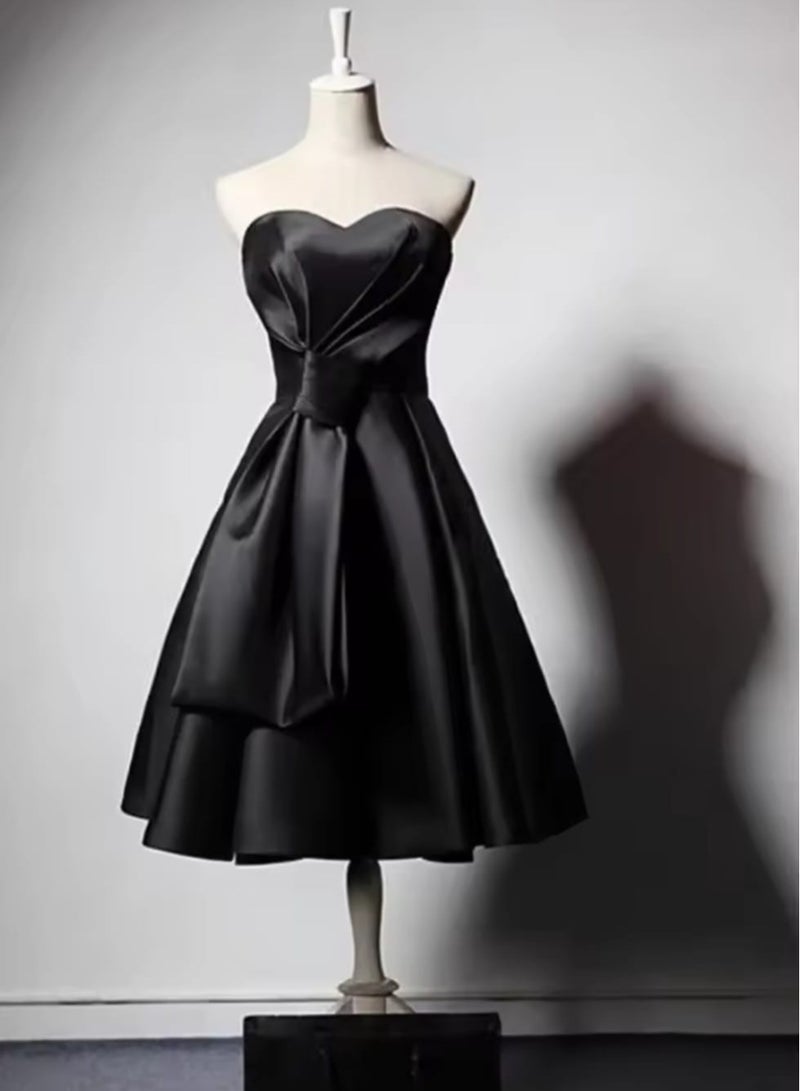Short black evening dress without sleeves and a tie at the waist with a corset back - Image 4