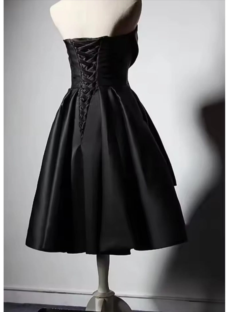 Short black evening dress without sleeves and a tie at the waist with a corset back - Image 2