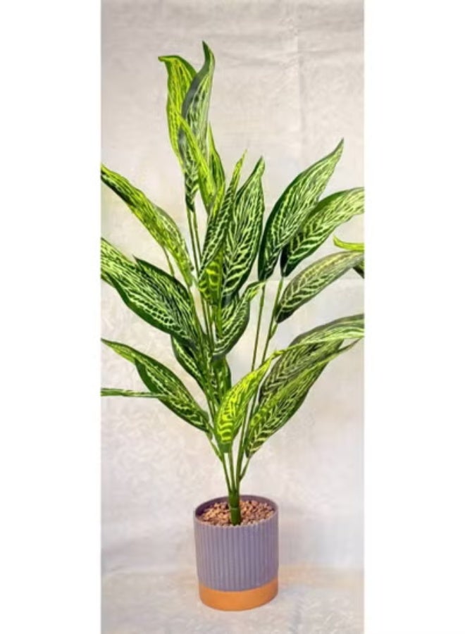 ناما نبات زينة صناعي وواقعي مثالي للديكورات الداخلية. يتميز بأوراق كبيرة وكثيفة باللون الأخضر الداكن والفاتح، مع عروق وتظليل يقلد مظهر نباتات الظل المعروفة مثل الديفنباخيا (Dieffenbachia) أو نباتات الأجالونيما (Aglaonema). بطول 80 سم - Image 3