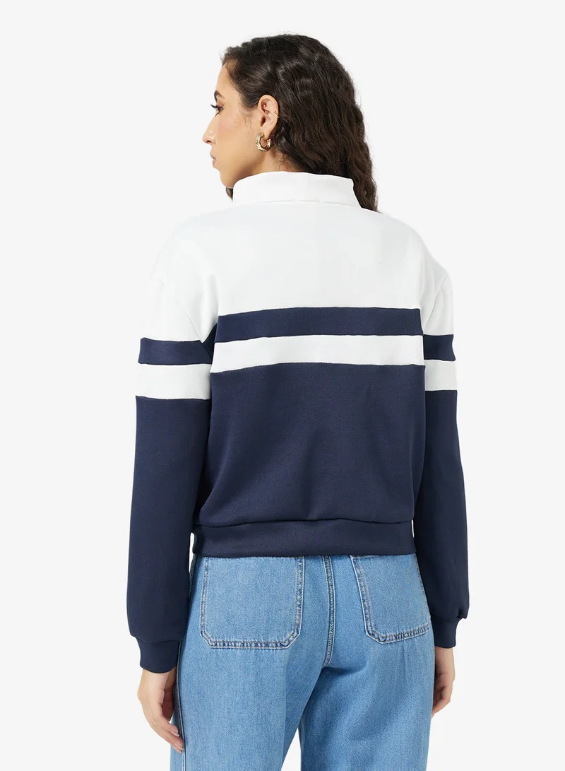 جينجر سترة رياضية بسحاب وكتل لونية