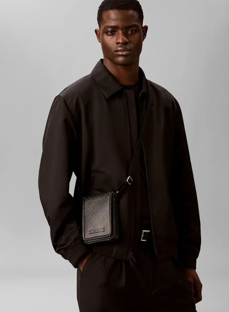 Calvin Klein Black Emblem Coated Phone Crossbody Bag for Men | Best Price UAE