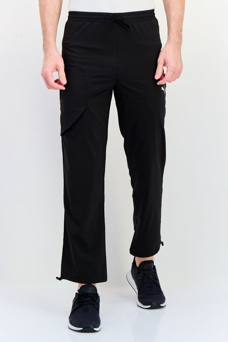 PUMA سروال رياضي للرجال بتصميم لائق بشعار العلامة التجارية، أسود - Image 1