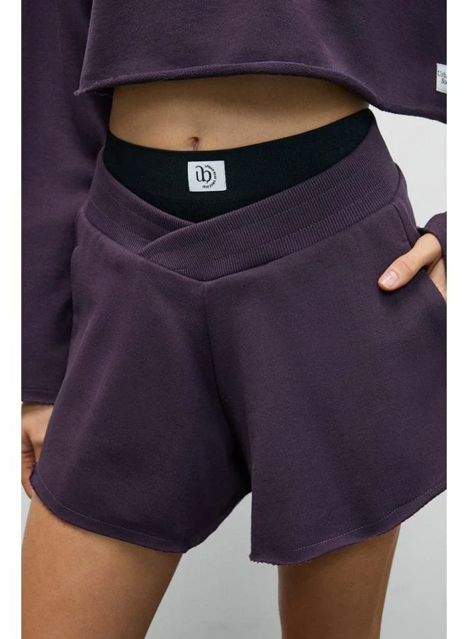Urban Beat HELOSIE Women's Asymmetric Oversized Purple Shorts with Waist Belt.