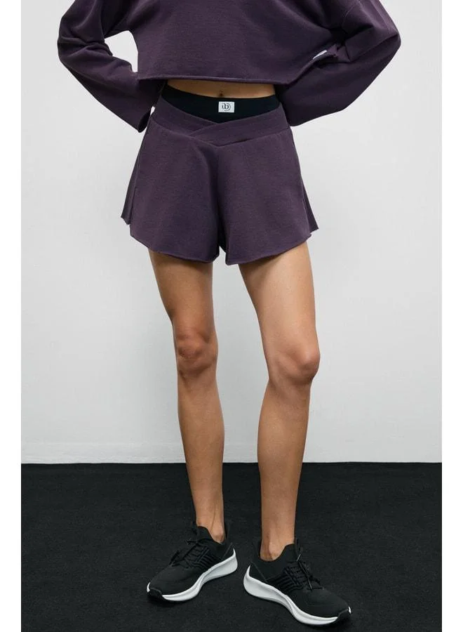 Urban Beat HELOSIE Women's Asymmetric Oversized Purple Shorts with Waist Belt.
