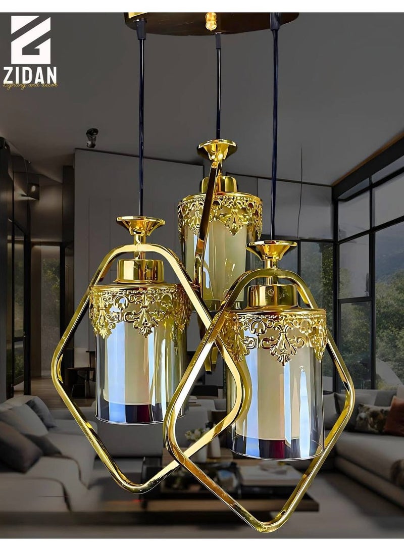 Modern triple metal pendant with a crown, gold color