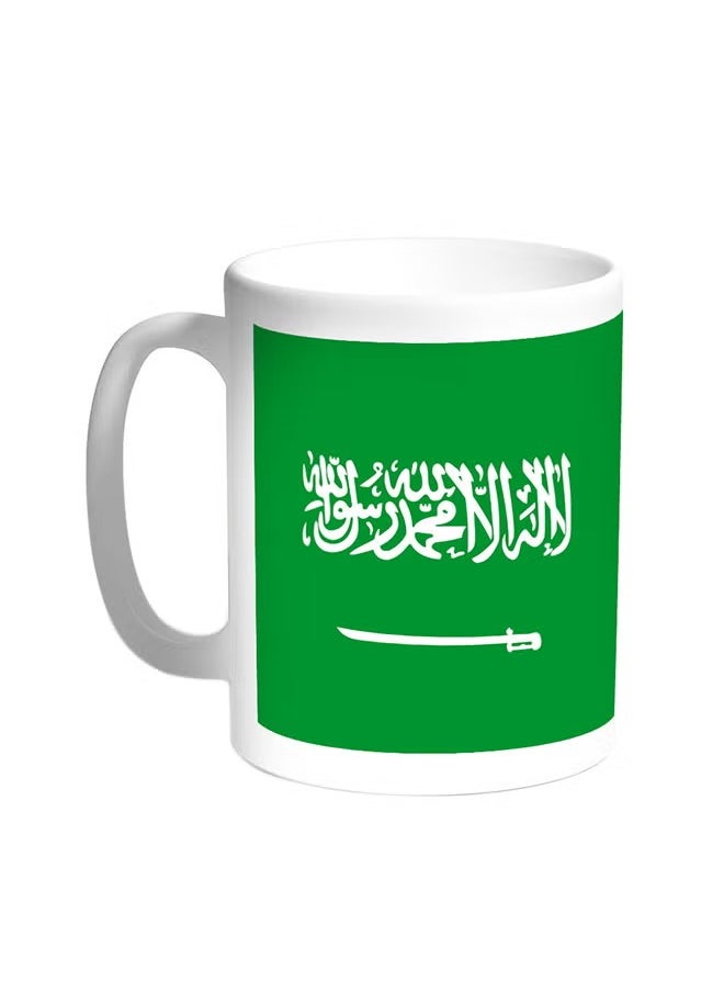 حكاية شمعة مج من السيراميك بطبعة تصميم "علم المملكة العربية السعودية" بلون أبيض  - Image 1