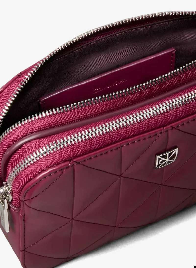 Calvin Klein Alluring Pink Quilted Emblem Logo Double Zip Camera Bag for Women | Best Price UAE