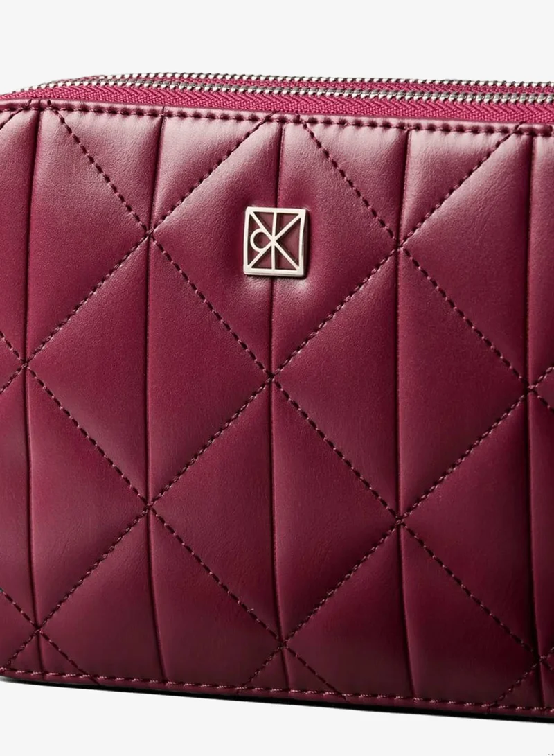 Calvin Klein Alluring Pink Quilted Emblem Logo Double Zip Camera Bag for Women | Best Price UAE