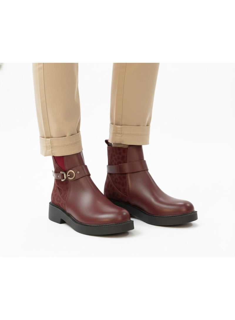 Stylish women's boots with a side pattern and elegant design, equipped with a metal strap. - Image 1