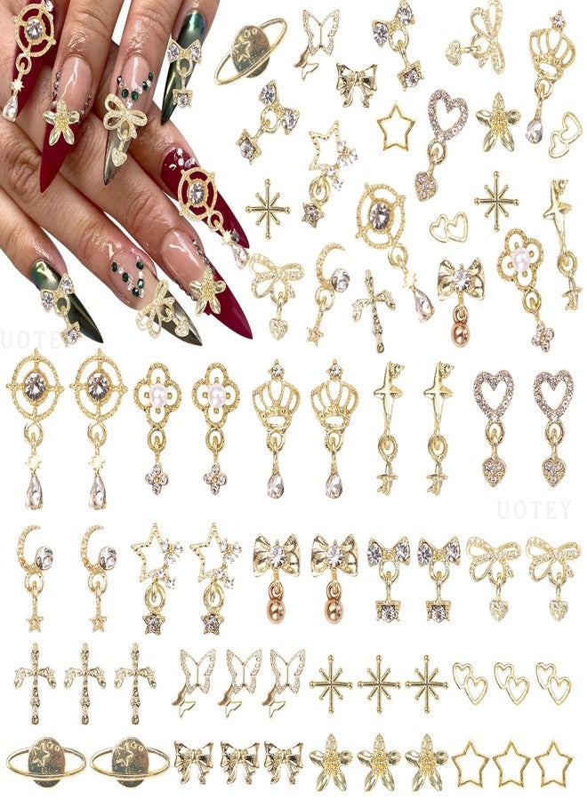 Uotey 100 Pcs Gold Dangle Nail Charms, Gold Heart Bow Stars Nails Charms and Gems, Metal Golden Planet Butterfly Cross Star Charm for Acrylic Nails Art DIY Design - Image 1