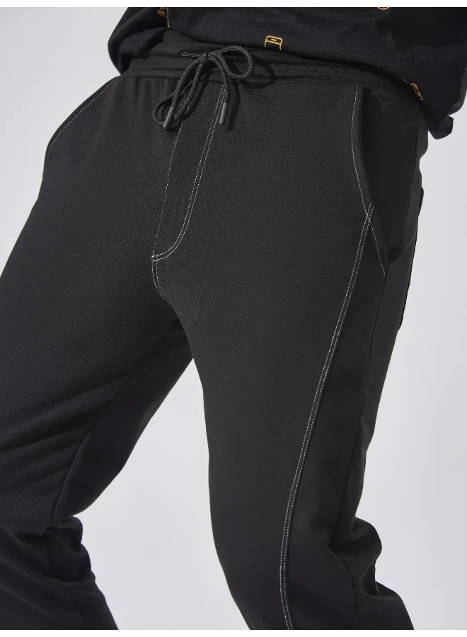 Maniac Mens Solid Stich Line 95% Polyester 5% Lycra French Terry fabric Black Slim Fit Trackpant