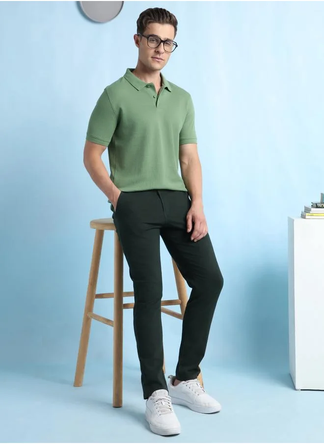 دينيس لينغو Trendy Olive Polo Neck T-Shirt for Men crafted from a 60% cotton and 40% polyester blend, featuring a solid pattern and half sleeves for a classic everyday look.