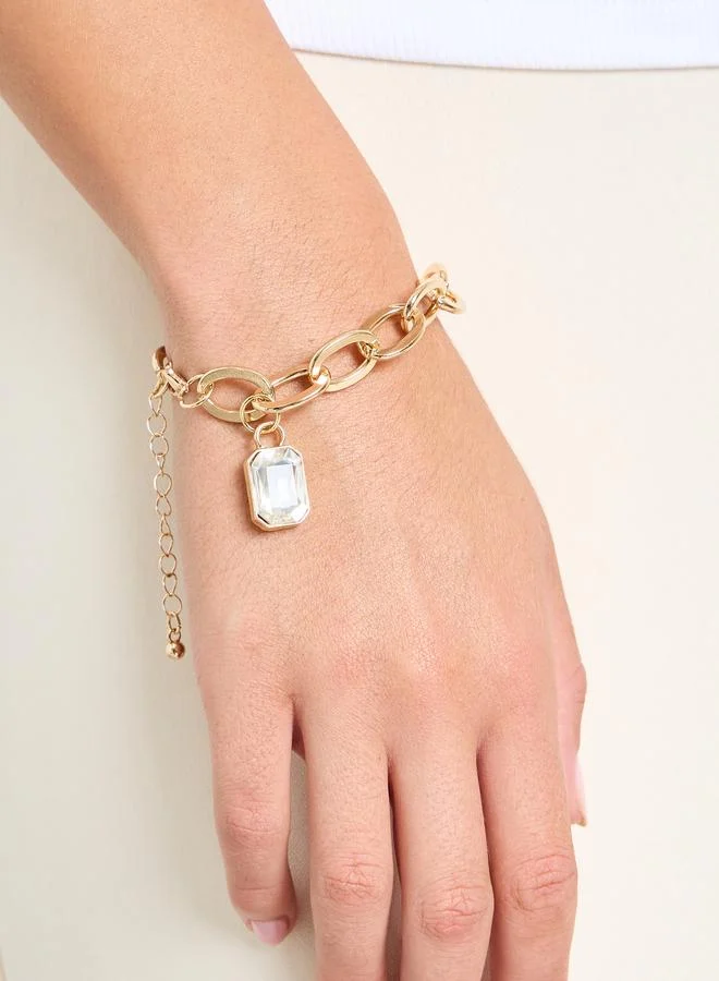 Gold Tone Link Bracelet with Clear Gemstone Charm