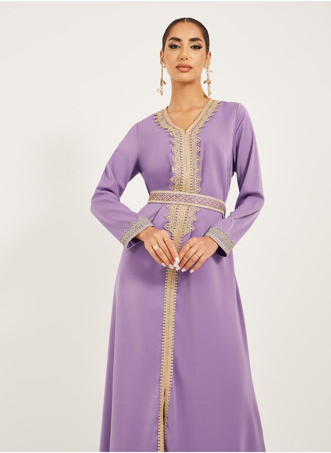 Arabic Kaftan with V neck and gold lace trims at neckline, sleeve hem and centre front along with fabric belt. Lace trim on fabric belt - pzsku/Z9E641EDA5EAE7EF53161Z/45/1741119743/3c643124-44c4-449d-8362-5f512f66fcb8