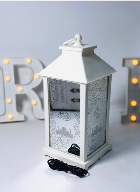 A selection of imported acrylic lanterns, high-quality, clean material in manufacturing. The lantern is made of Ramadan Kareem glass, LED lights, music and Ramadan songs. It works with stones and a USB connection. It has a balloon and a switch to control the direction of the sound and the direction of the light only. The size is 35*16 cm.
